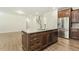 Stylish kitchen island with granite countertops, stainless steel appliances and cabinetry offering ample storage at 605 Hampton Crest Ct, Fuquay Varina, NC 27526