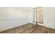 Spacious office with French doors, wood flooring, and detailed trim, ideal for a home office or study at 605 Hampton Crest Ct, Fuquay Varina, NC 27526