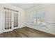 Well-lit office featuring French doors, hardwood floors, and elegant trim, creating a professional workspace at 605 Hampton Crest Ct, Fuquay Varina, NC 27526