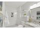 Modern bathroom featuring a tiled shower with niche, granite vanity, and stylish fixtures at 610 N Driver St, Durham, NC 27703
