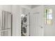 Convenient laundry room with stacked washer/dryer, storage shelves, and easy access to the outside at 610 N Driver St, Durham, NC 27703