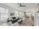 Bright living room featuring neutral walls, hardwood floors, and an open layout to the dining area at 610 N Driver St, Durham, NC 27703