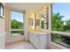 Bright bathroom features double vanity, Hollywood lights, and tree-lined views at 620 Martin Luther King Jr Blvd # Apt 502, Chapel Hill, NC 27514
