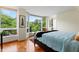 Light-filled bedroom featuring bay window with leafy, green views at 620 Martin Luther King Jr Blvd # Apt 502, Chapel Hill, NC 27514