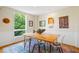 Bright dining room with a wooden table, modern chairs, and a large window with natural light at 620 Martin Luther King Jr Blvd # Apt 502, Chapel Hill, NC 27514
