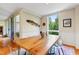 Stylish dining room with a unique fish sculpture, light wood table, and view to balcony at 620 Martin Luther King Jr Blvd # Apt 502, Chapel Hill, NC 27514
