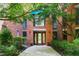 Charming brick building entrance framed by lush greenery, flowers, and a well-maintained walkway offers curb appeal at 620 Martin Luther King Jr Blvd # Apt 502, Chapel Hill, NC 27514