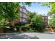 Well-maintained brick building with manicured landscaping and mature trees offers a peaceful and inviting neighborhood setting at 620 Martin Luther King Jr Blvd # Apt 502, Chapel Hill, NC 27514