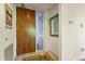 Inviting foyer with decorative door and mirror, tile flooring, and clean white walls with artwork creates a bright space at 620 Martin Luther King Jr Blvd # Apt 502, Chapel Hill, NC 27514