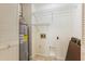 Functional laundry room with a water heater and shelving at 620 Martin Luther King Jr Blvd # Apt 502, Chapel Hill, NC 27514