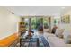 Inviting living room with a plush sofa, balcony access, and a beautifully patterned rug at 620 Martin Luther King Jr Blvd # Apt 502, Chapel Hill, NC 27514