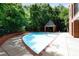 Community pool area surrounded by lush trees and a covered seating area is an oasis for residents to unwind at 620 Martin Luther King Jr Blvd # Apt 502, Chapel Hill, NC 27514