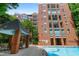 Community pool area near a brick apartment complex at 620 Martin Luther King Jr Blvd # Apt 502, Chapel Hill, NC 27514