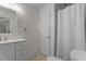 Neutral bathroom with a shower/tub combination and a white vanity at 6904 Sandringham Dr, Raleigh, NC 27613