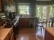 Kitchen with wooden cabinets, hardwood floors and natural light with a view of the backyard at 713 Beddingfield Dr, Knightdale, NC 27545