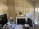 Bright living room featuring a fireplace with decorative molding and high ceilings at 713 Beddingfield Dr, Knightdale, NC 27545