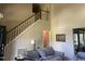 Grand staircase leading to the second floor, adjacent to a cozy living area at 713 Beddingfield Dr, Knightdale, NC 27545