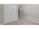 A bedroom with carpet flooring, light gray walls, and a closet, providing a cozy and functional space at 7407 Sandy Creek Dr, Raleigh, NC 27615