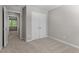 Bedroom featuring neutral walls, carpet, and a view into the backyard at 7407 Sandy Creek Dr, Raleigh, NC 27615