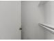 A tidy closet with shelving and hanging rod providing ample storage space and organization at 7407 Sandy Creek Dr, Raleigh, NC 27615