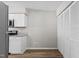 Open kitchen area with stainless steel microwave and range, white cabinets, and pantry at 7407 Sandy Creek Dr, Raleigh, NC 27615