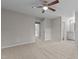 Spacious main bedroom with carpet flooring, neutral walls, and ceiling fan, with an ensuite bathroom at 7407 Sandy Creek Dr, Raleigh, NC 27615
