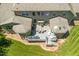 Aerial view of a large home with a deck and lush green backyard at 7544 Hasentree Club Dr, Wake Forest, NC 27587