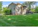 Spacious backyard featuring a well-kept lawn and a deck on the house at 7544 Hasentree Club Dr, Wake Forest, NC 27587