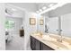 Bathroom features a double sink vanity with dark wood cabinets at 7544 Hasentree Club Dr, Wake Forest, NC 27587