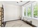 Bedroom boasts natural light with large windows, wood floors, and neutral walls at 7544 Hasentree Club Dr, Wake Forest, NC 27587