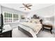 Bedroom featuring a bed with decorative pillows and plenty of natural light from the window at 7544 Hasentree Club Dr, Wake Forest, NC 27587