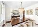 Elegant dining room boasts a modern chandelier, stylish furniture, and a decorative sideboard at 7544 Hasentree Club Dr, Wake Forest, NC 27587