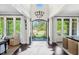 Elegant foyer with high ceilings, hardwood floors, and views of the beautifully landscaped front yard at 7544 Hasentree Club Dr, Wake Forest, NC 27587