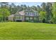 Expansive two-story home featuring well-maintained landscaping and a large front yard at 7544 Hasentree Club Dr, Wake Forest, NC 27587