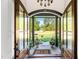 Charming front porch with a view of the lush green lawn and mature trees at 7544 Hasentree Club Dr, Wake Forest, NC 27587