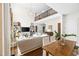 Open-concept living space with fireplace, balcony overlook, comfortable seating, and ample natural light at 7544 Hasentree Club Dr, Wake Forest, NC 27587