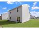 Spacious backyard with lush green grass, sliding glass door, and ample space for outdoor activities at 815 Rhino Bnd, Oxford, NC 27565