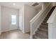 Inviting entryway featuring wood-look floors, a stairway, and natural light from the front door at 815 Rhino Bnd, Oxford, NC 27565