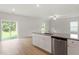 Open kitchen and living area with granite countertops and modern fixtures at 815 Rhino Bnd, Oxford, NC 27565