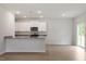 Modern kitchen featuring granite countertops, stainless steel appliances, and ample natural light at 815 Rhino Bnd, Oxford, NC 27565