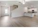 Open-concept living space showcasing modern flooring and a kitchen with granite countertops at 815 Rhino Bnd, Oxford, NC 27565