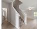 Carpeted stairs leading to the upper level, complemented by modern wood-look floors at 815 Rhino Bnd, Oxford, NC 27565