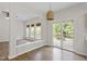 Bright dining room area with hardwood floors, natural light, and patio access at 8721 Springhouse Ln, Raleigh, NC 27617