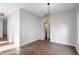 Bright dining room featuring wood floors, neutral walls, and modern lighting fixture at 8721 Springhouse Ln, Raleigh, NC 27617