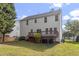 Exterior view of this house and deck, also showing part of the backyard at 8721 Springhouse Ln, Raleigh, NC 27617