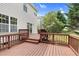 This large wooden back deck leads to a yard with mature trees, a space perfect for entertaining at 8820 Waynick Dr, Raleigh, NC 27617