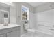 Clean bathroom featuring a vanity, toilet, and tub with shower at 8820 Waynick Dr, Raleigh, NC 27617