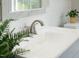 Bathroom featuring white countertops, double sinks, marble floors, and attractive fixtures at 8820 Waynick Dr, Raleigh, NC 27617