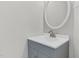 Bathroom sink with gray vanity and brushed nickel faucet at 8820 Waynick Dr, Raleigh, NC 27617