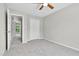 This bedroom features neutral walls, carpet flooring, and a closet with ample storage space at 8820 Waynick Dr, Raleigh, NC 27617